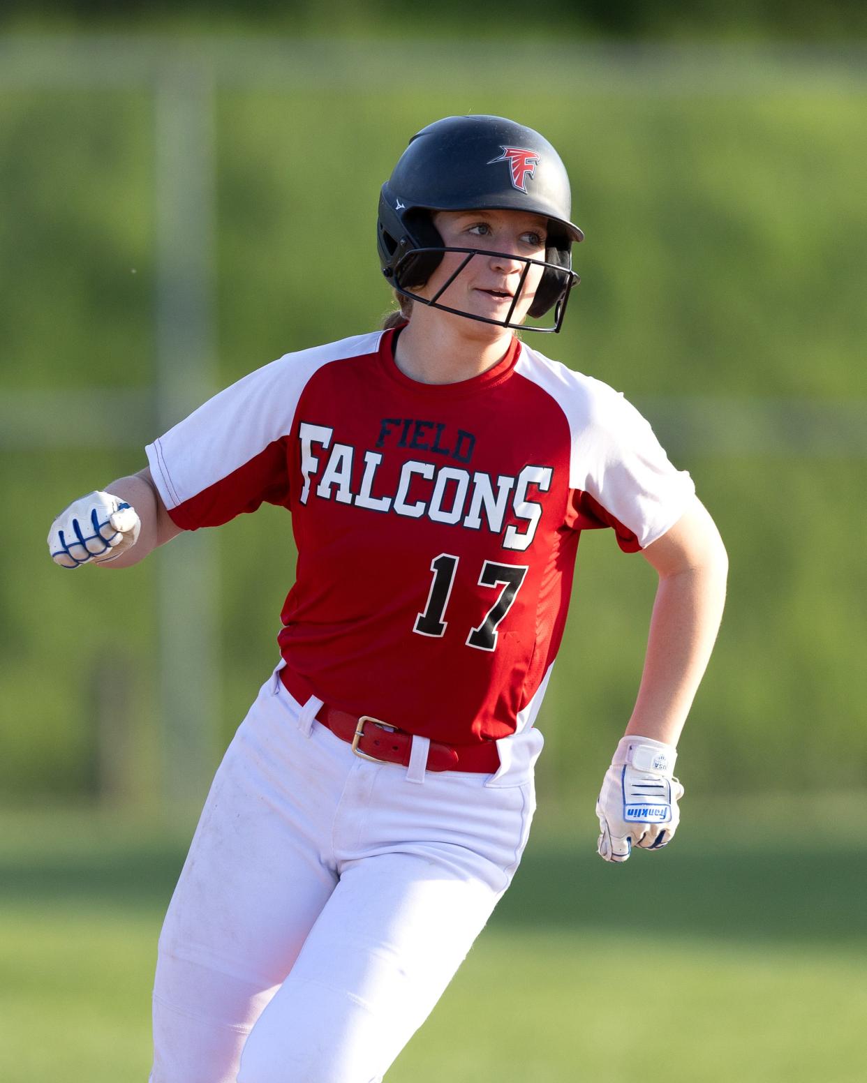 Field’s Maddie Burge watches as her homer sails out of the park during a high school softball game against the Coventry Comets Monday, April 29 in Coventry Township.