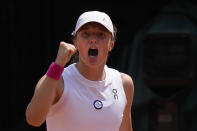 Poland's Iga Swiatek celebrates winning her quarterfinal match of the French Open tennis tournament against Coco Gauff of the U.S. in two sets 6-4, 6-2, at the Roland Garros stadium in Paris, Wednesday, June 7, 2023. (AP Photo/Thibault Camus)