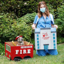 <p>Katherine Schwarzenegger and her pup Maverick honored essential workers on Tuesday by upcycling some Amazon Smile boxes to make Halloween boxtumes. </p>