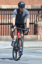 <p>Harrison Ford rides his bike through Mayfair on July 23 in London.</p>