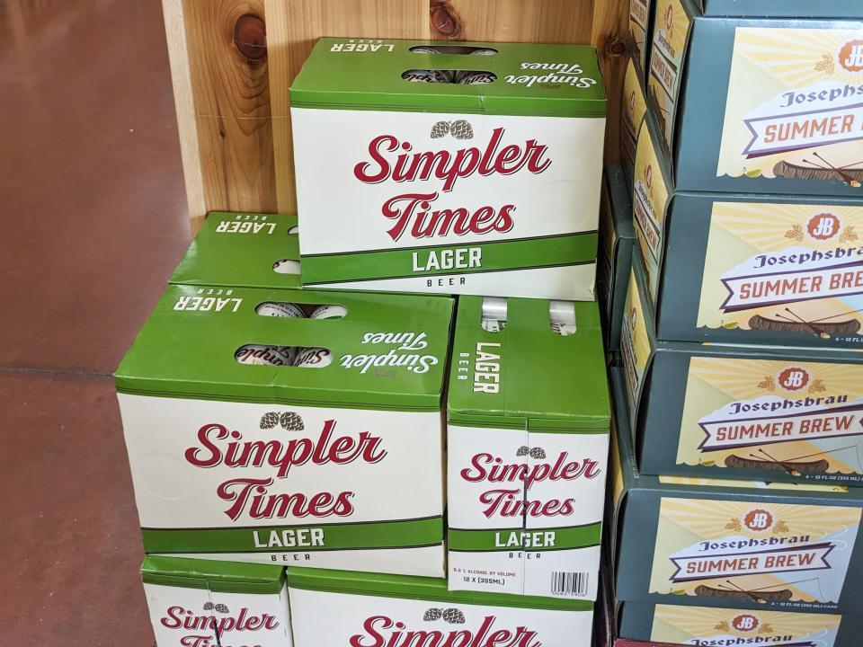 Boxes of Simpler Times lager beer stacked at Trader Joe's.