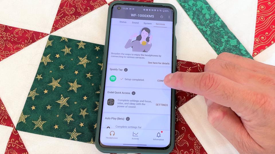 Sony WF-1000XM5 headphones connect app showing Spotify Tap