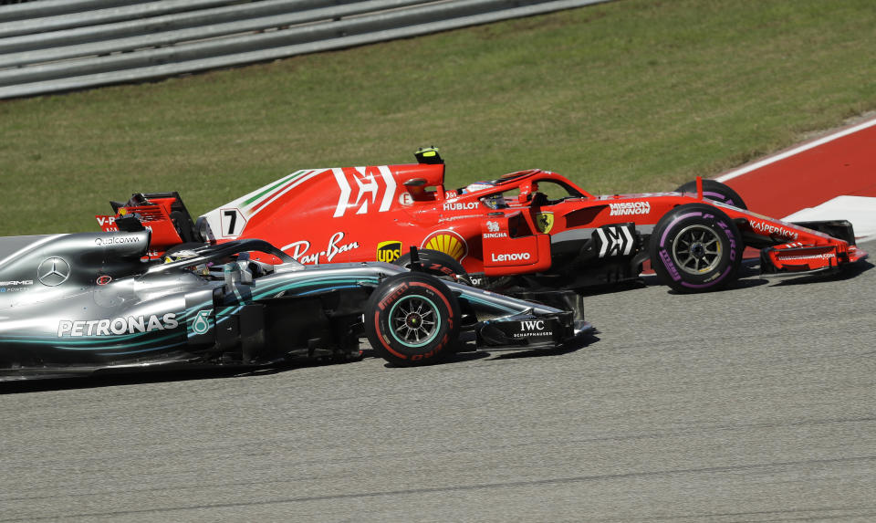 Ferrari driver Kimi Raikkonen, of Finland, passes Mercedes driver Lewis Hamilton, of Britain, during the Formula One U.S. Grand Prix auto race at the Circuit of the Americas, Sunday, Oct. 21, 2018, in Austin, Texas. (AP Photo/Eric Gay)