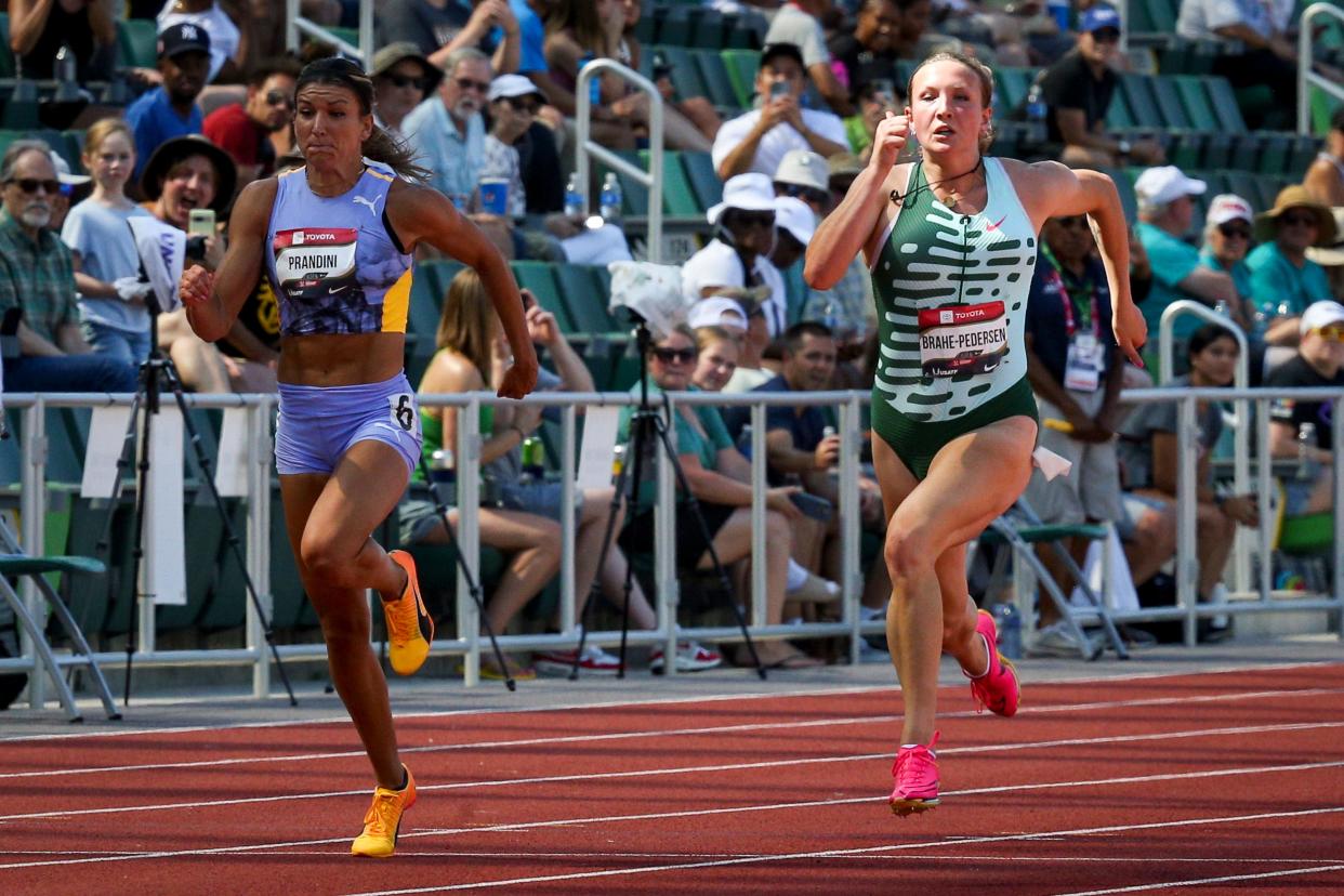 Mia Brahe-Pedersen, right, and Jenna Prandini sprint to the finish line in the first round of the women’s 100 meter dash on day one of the USA Outdoor Track and Field Championships at Hayward Field in Eugene Thursday, July 6, 2023.