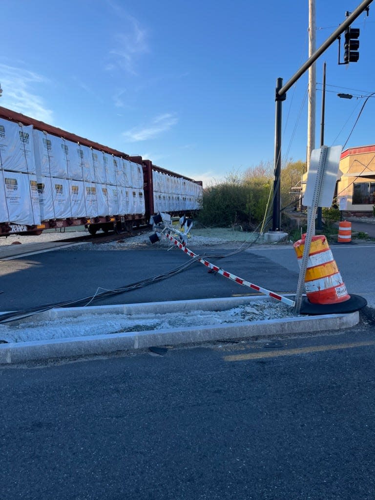 A train came in contact with some low-hanging utility wires on Tuesday, leading to some damage at the Tarkiln Hill Road train crossing.