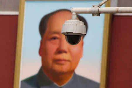 A security camera is attached to a pole in front of the portrait of former Chinese Chairman Mao Zedong on Beijing's Tiananmen Square, China May 19, 2017. REUTERS/Thomas Peter