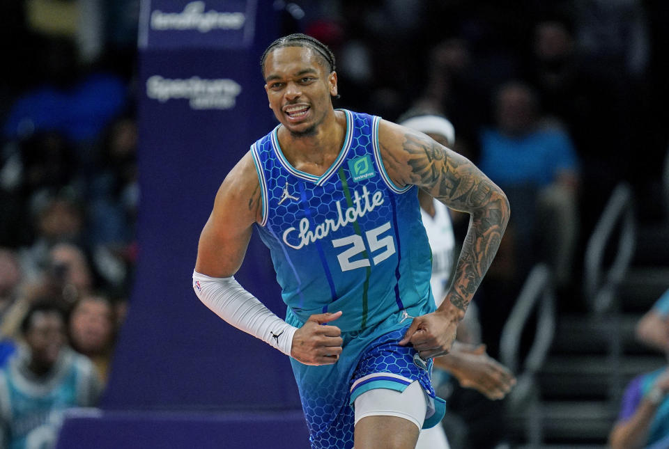 Charlotte Hornets forward P.J. Washington (25) celebrates after a basket against the Dallas Mavericks during an NBA basketball game on Saturday, March 19, 2022, in Charlotte, N.C. (AP Photo/Rusty Jones)