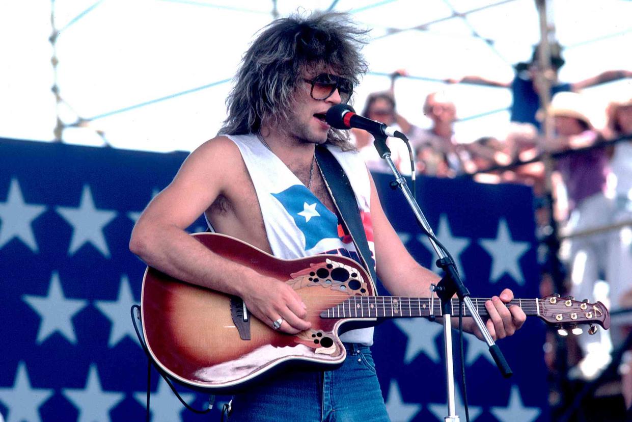 <p>Paul Natkin/Getty</p> Jon Bon Jovi performs in Austin, Texas in July 1986