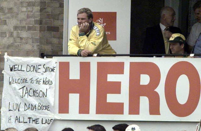 Shane Warne, during a Cricket World Cup match against New Zealand at Sophia Gardens, Cardiff, with a message pinned up on the team balcony congratulating his wife Simone on the birth of their son Jackson in 1999 