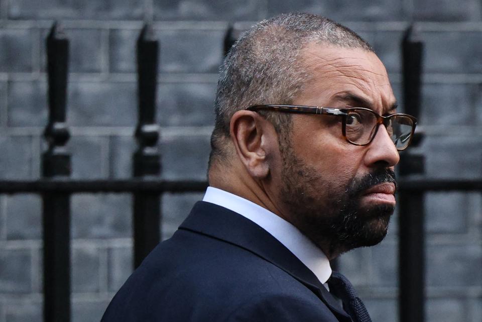 Britain's Home Secretary James Cleverly leaves from 10 Downing Street in central London on Tuesday after attending a cabinet meeting (AFP via Getty Images)