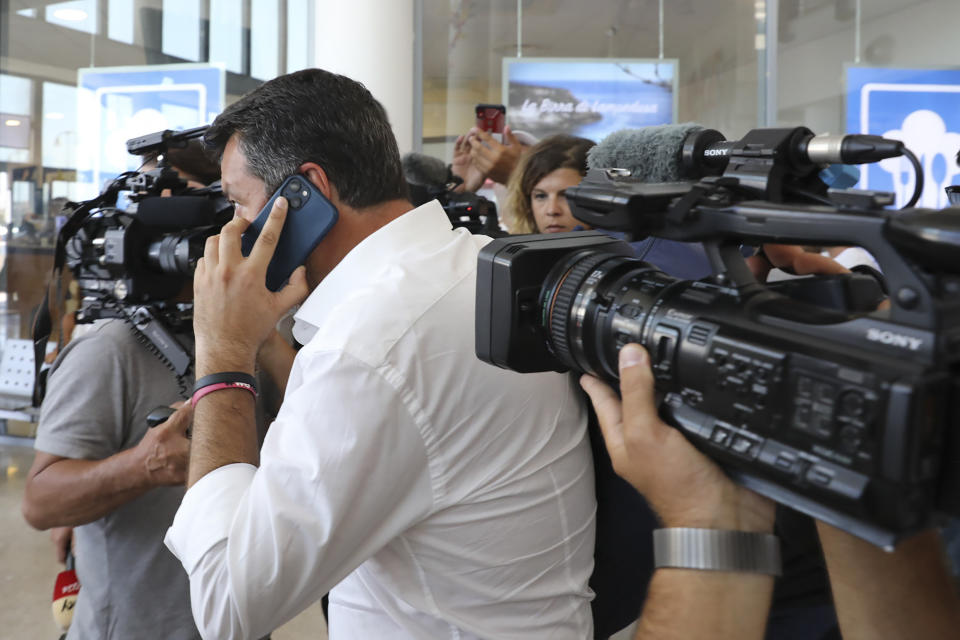 Italy's former Interior minister, Matteo Salvini and Leader of The League party, is chased by journalists upon his arrival at the airport in the Sicilian Island of Lampedusa, Italy, Thursday, Aug. 4, 2022. Salvini is making a stop Thursday on Italy's southernmost island of Lampedusa, the gateway to tens of thousands of migrants arriving in Italy each year across the perilous central Mediterranean Sea. (AP Photo/David Lohmueller)
