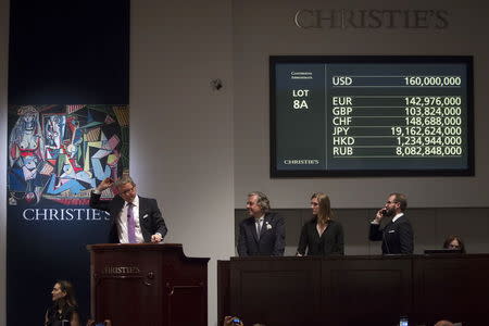 Auctioneer Jussi Pylkkanen drops the gavel as he sells Pablo Picasso's "Les femmes d'Alger (Version 'O')" (Women of Algiers) at Christie's Auction House in the Manhattan borough New York May 11, 2015. REUTERS/Carlo Allegri