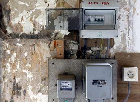 Electricity meters are pictured in a house in the 1920s Bon Air (Good Air) housing estate before its renovation in Brussels August, 20, 2015. REUTERS/Francois Lenoir