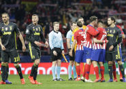 Atletico players celebrate, at the end of the Champions League round of 16 first leg soccer match between Atletico Madrid and Juventus at Wanda Metropolitano stadium in Madrid, Wednesday, Feb. 20, 2019. (AP Photo/Andrea Comas)