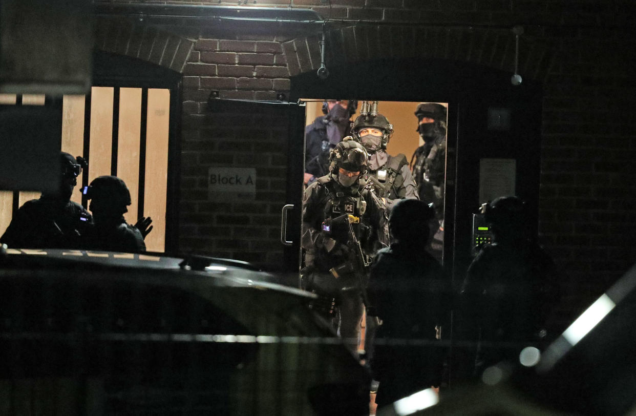 Armed police officers at a block of flats off the Basingstoke Rd in Reading after an incident at Forbury Gardens in Reading town centre.