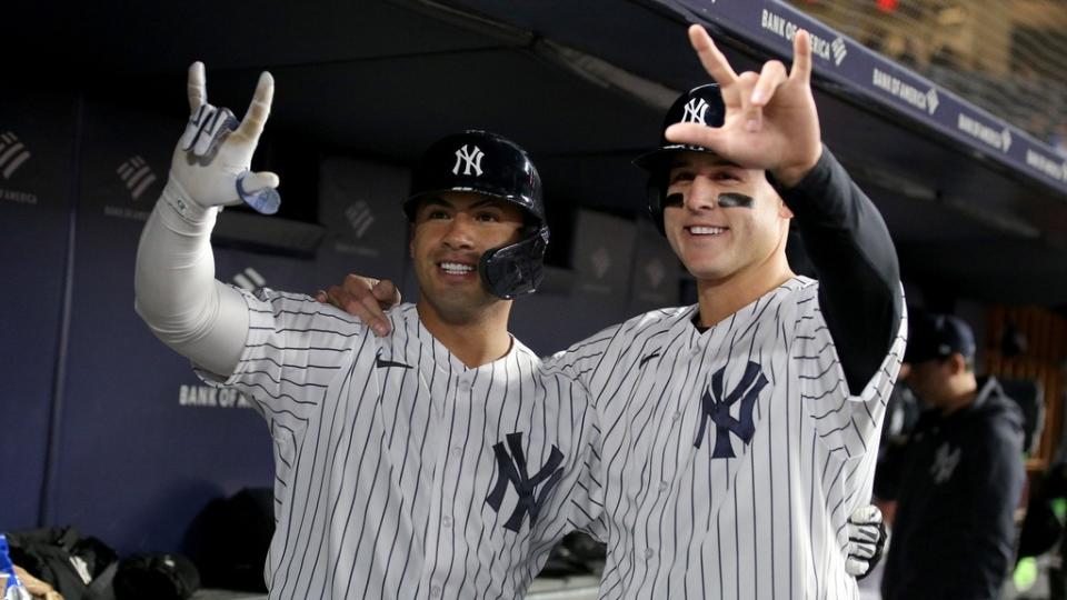 New York Yankees second baseman Gleyber Torres (25) celebrates his two run home run against the Oakland Athletics in the dugout with first baseman Anthony Rizzo (48) during the fifth inning at Yankee Stadium.