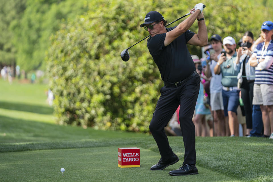 Phil Mickelson tees off on the 18th hole during the third round of the Wells Fargo Championship golf tournament at Quail Hollow on Saturday, May 8, 2021, in Charlotte, N.C. (AP Photo/Jacob Kupferman)