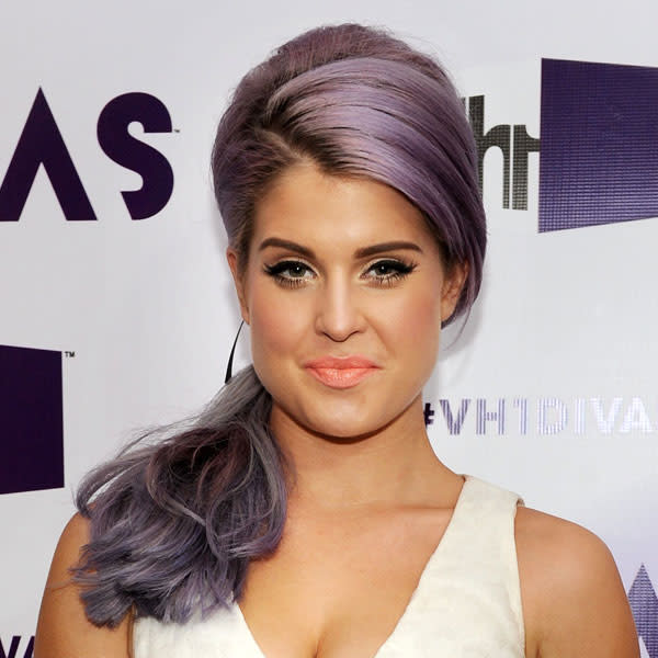 <b>Kelly Osbourne </b><br><br>The TV personality swept her lilac locks into a side ponytail and teamed it with a feline flick of eyeliner and matte peach lipstick.<br><br>© Rex