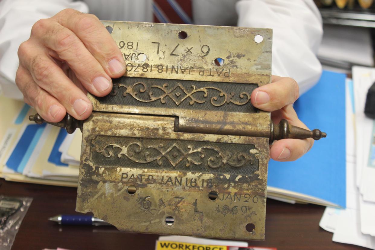 A historic door hinge that was damaged in the tornado that hit Clarksville on January 22, 1999.