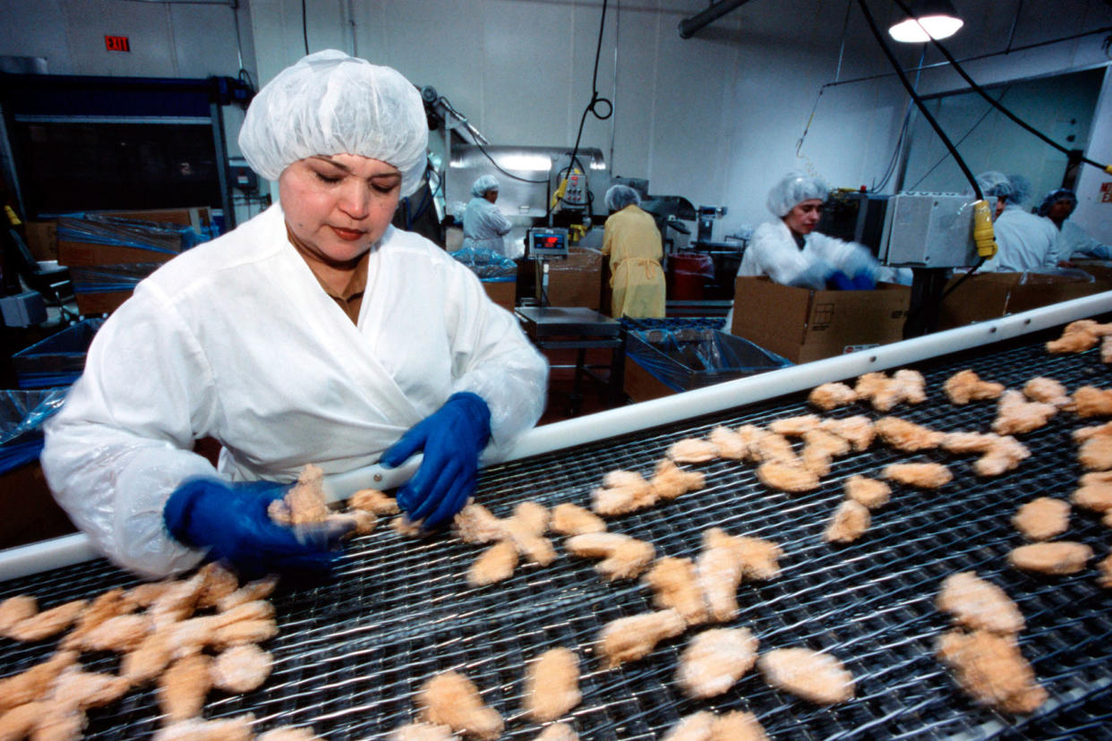 Employees of Tyson Foods Inc. process chicken Greg Smith/Corbis via Getty Images