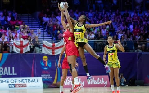 Eboni Usoro-Brown of England (L) and Shanice Beckford of Jamaica (R) jump for the ball during their Vitality Netball World Cup match at M&S Bank Arena - Credit: GETTY IMAGES