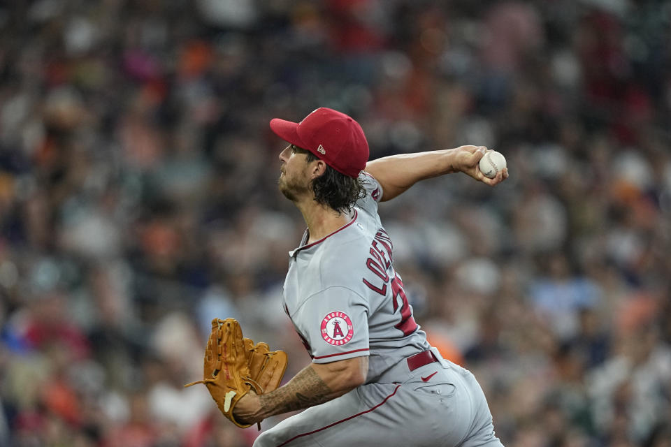 Los Angeles Angels starting pitcher Michael Lorenzen throws against the Houston Astros during the first inning of a baseball game Friday, July 1, 2022, in Houston. (AP Photo/David J. Phillip)