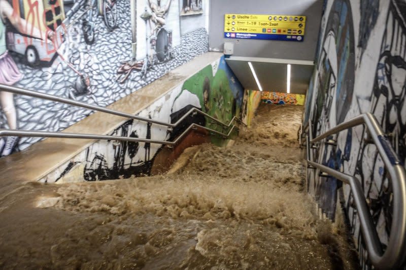 Flood waters pour down the stairs of the Porta Garibaldi station in Milan after the Seveso river breached its banks Tuesday in a violent storm that also flooded areas around Lake Como. Photo by Matteo Corner/EPA-EFE/