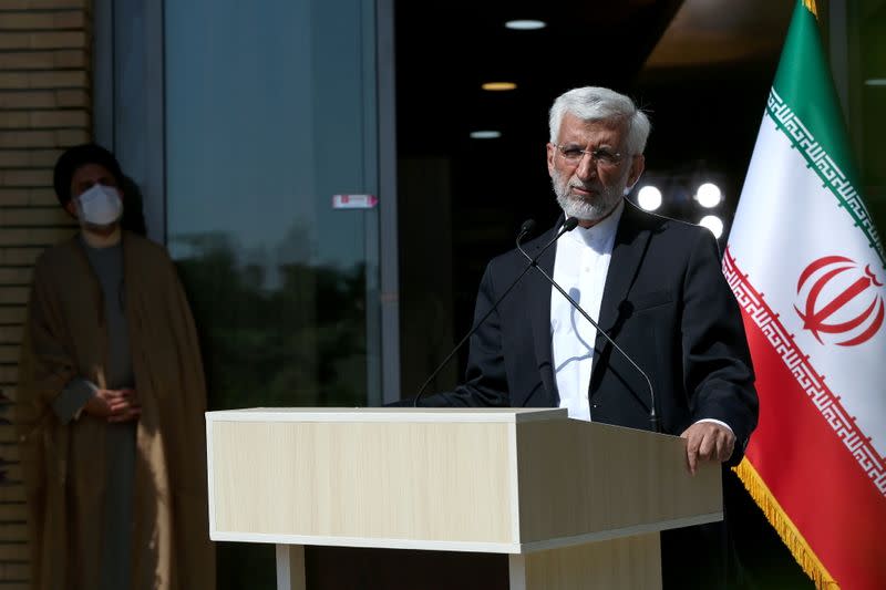 Presidential candidate Saeed Jalili ​​speaks with journalists before the start of the last election debate, in Tehran