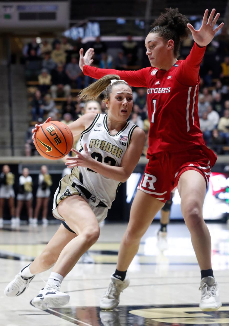 Purdue Boilermakers guard Abbey Ellis (23) drives into Rutgers Scarlet Knights guard Destiny Adams (1) during the NCAA women’s basketball game, Tuesday, Jan. 2, 2024, at Mackey Arena in West Lafayette, Ind.