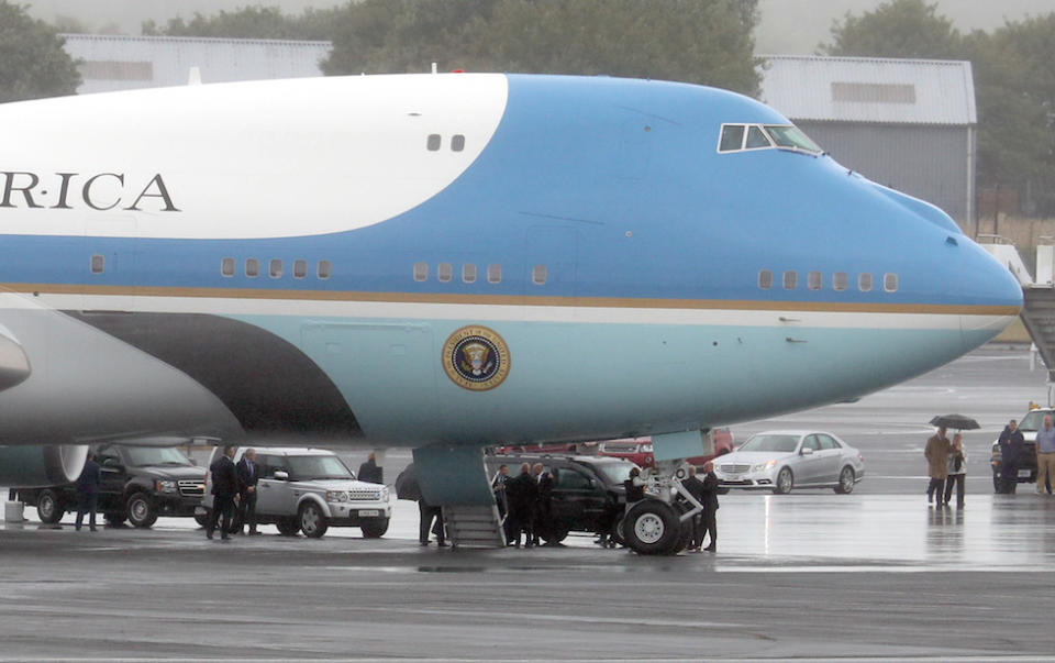 The US presidential convoy arrives at Air Force One at Prestwick Airport in Ayrshire (Picture: PA)