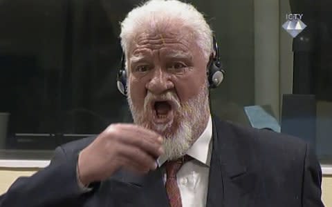 Slobodan Praljak screamed 'I am not a war criminal' before raising the liquid to his mouth