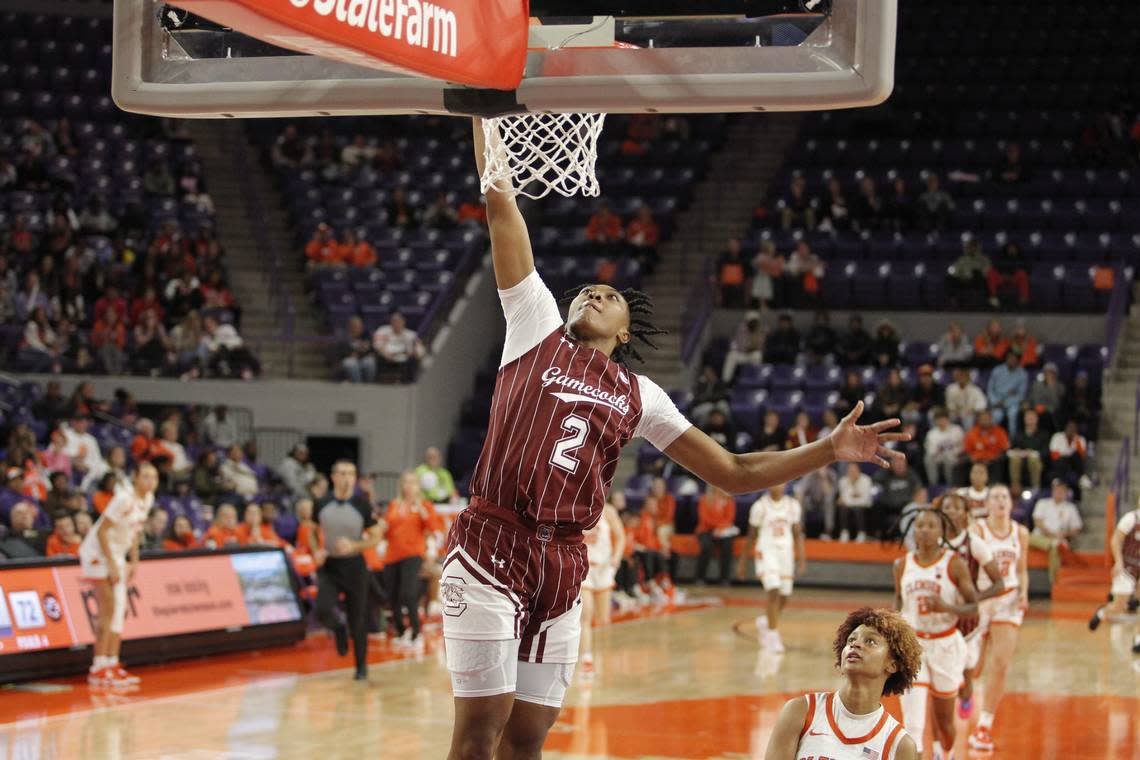 South Carolina forward Ashlyn Watkins (2) throws down a dunk over Clemson guard Ruby Whitehorn during second-half action in Clemson, S.C. on Thursday, Nov. 17, 2022. (Travis Bell/SIDELINE CAROLINA)