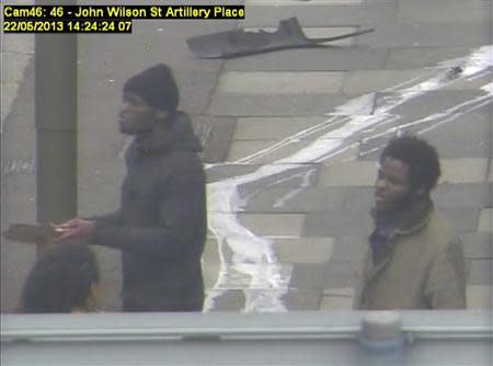 Michael Adebowale (R) and Michael Adebolajo speak to members of the public in Woolwich in this handout still image taken from May 22, 2013 CCTV footage by the Metropolitan Police, that was shown to the jury during the Lee Rigby murder trial at the Old Bailey in London December 3, 2013. REUTERS/Metropolitan Police/Handout via Reuters