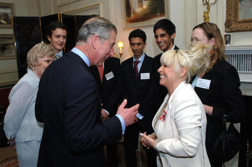 Actress Barbara Windsor shares a joke with the Prince of Wales at a reception for Age Concern at Clarence House in London.