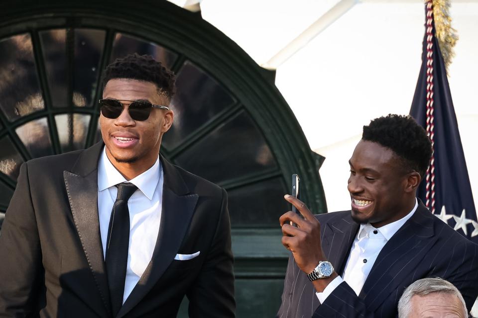 Giannis Antetokounmpo (left) and Thanasis Antetokounmpo (right) interact as U.S. President Joe Biden welcomes the Milwaukee Bucks to the South Lawn of the White House to honor the team for its NBA Championship.