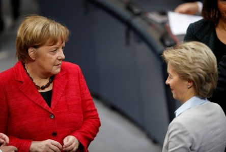 German Chancellor Angela Merkel speaks with Defence Minister Ursula von der Leyen as they attend a meeting of the Bundestag in Berlin, Germany, November 21, 2017. REUTERS/Axel Schmidt