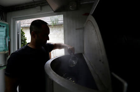 Radek Spacil, co-owner of the "Smart Brewery", brews a beer in a portable brewery built in a standard shipping container, in Prague, Czech Republic, September 2, 2017. Picture taken September 2, 2017. REUTERS/David W Cerny