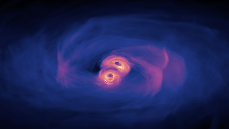 Two small dark dots surrounded by gas clouds rotate near each other.