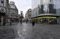 A nearly empty Leicester Square, in London, Tuesday, Nov. 24, 2020. Haircuts, shopping trips and visits to the pub will be back on the agenda for millions of people when a four-week lockdown in England comes to an end next week, British Prime Minister Boris Johnson said Monday. (AP Photo/Alberto Pezzali)