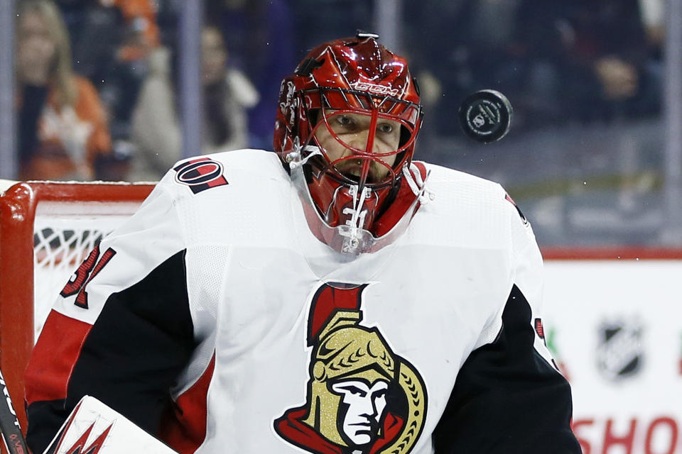 Ottawa Senators' Anders Nilsson blocks a shot during the second period of an NHL hockey game against the Philadelphia Flyers, Saturday, Dec. 7, 2019, in Philadelphia. (AP Photo/Matt Slocum)