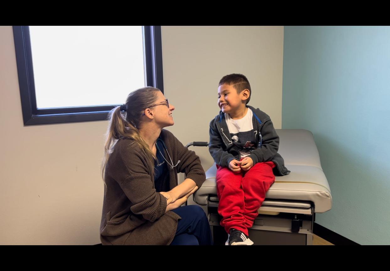 Dr. Claire Hebner meets with a patient at Lirios Pediatrics. The new Austin pediatric clinic offers free care, including medications and X-rays.