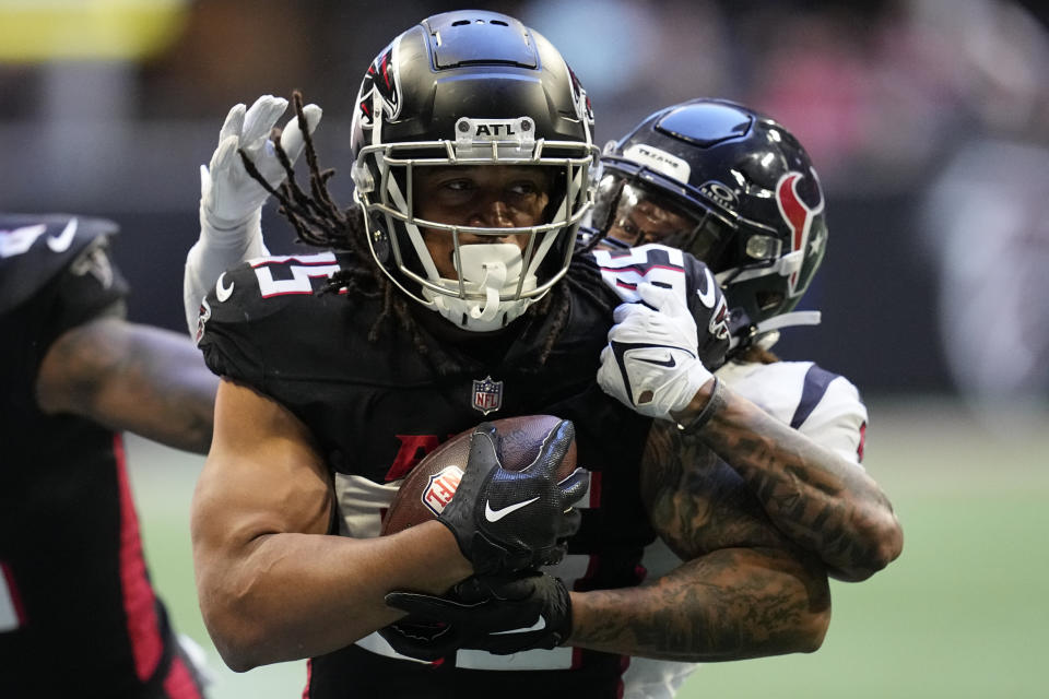 Atlanta Falcons tight end MyCole Pruitt (85) runs against Houston Texans cornerback Ka'dar Hollman (20) in the second half of an NFL football game in Atlanta, Sunday, Oct. 8, 2023. (AP Photo/Mike Stewart)