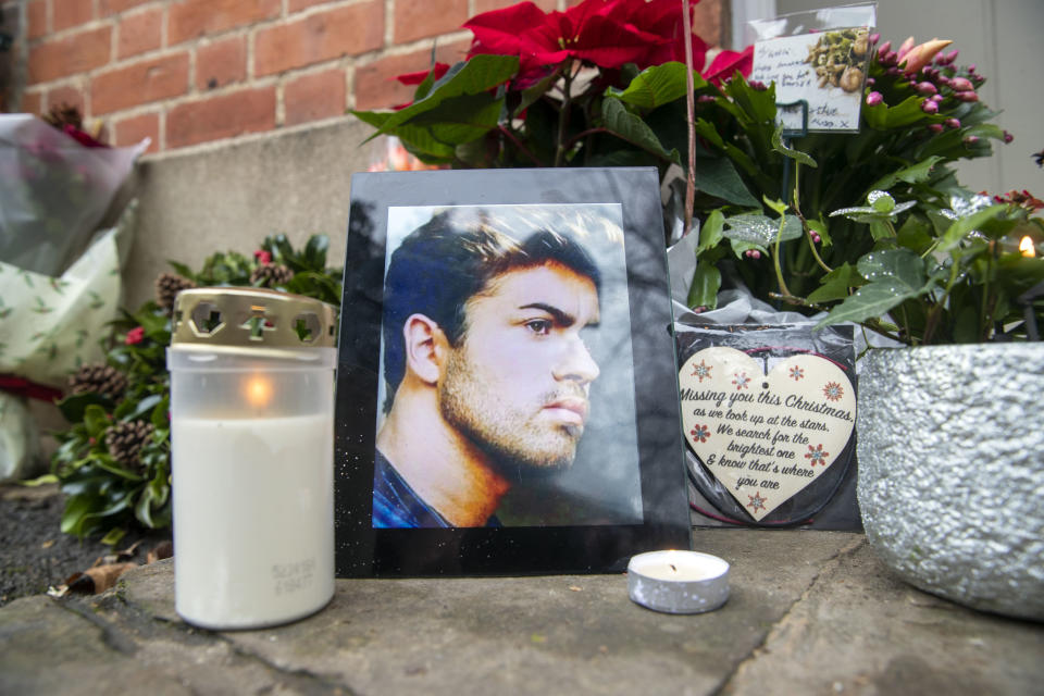 Floral tributes are left outside the home of George Michael in Goring-on-Thames, Oxfordshire, on the second anniversary of the singer's death.