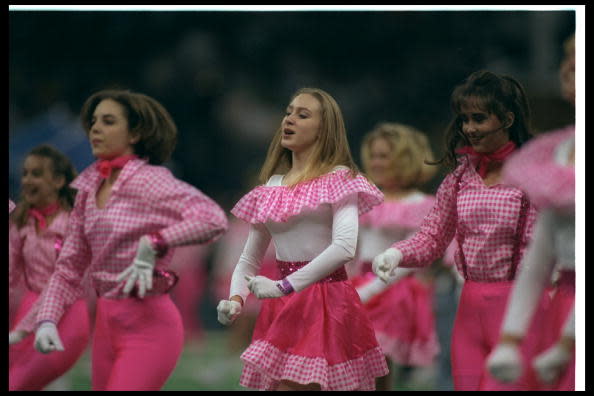 <div class="caption-credit"> Photo by: Getty Images/Al Bello</div>We have no idea what was going on here, besides the fact that it was 1997 and that, apparently, flouncy pink gingham figures in perfectly with a "Blues Brothers Bash" halftime theme.