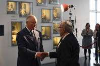 Britain's Prince Charles, left, joins a reception for British Holocaust survivors at the Israel Museum in Jerusalem, Thursday Jan. 23, 2020. Prince Charles is among dozens of presidents, heads of state and dignitaries who have descended upon the city to attend the largest-ever gathering focused on commemorating the Holocaust and combating modern-day anti-Semitism. (Neil Hall/Pool via AP)