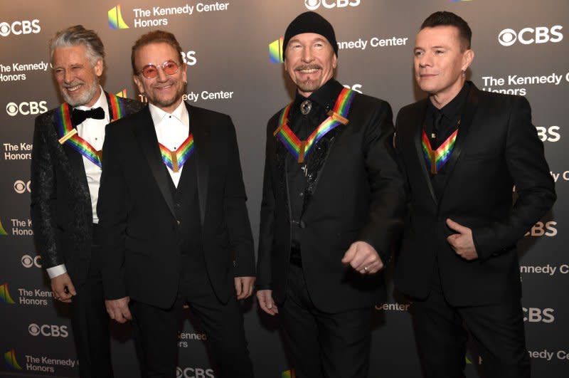 Left to right, U2 members Adam Clayton, Bono, the Edge and Larry Mullen Jr. pose for photographers as they arrive for the Kennedy Center gala in 2022. Bono and The Edge opened The Clarence Hotel in Dublin, Ireland, more than 30 years ago. File Photo by Mike Theiler/UPI