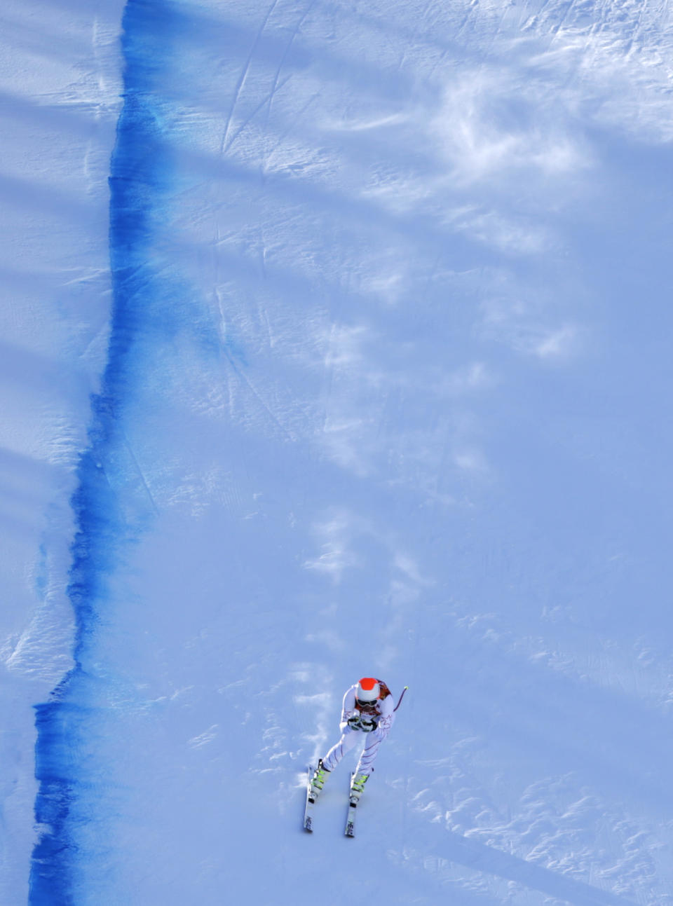 United States' Bode Miller speeds to the finish during men's downhill training at the Sochi 2014 Winter Olympics, Thursday, Feb. 6, 2014, in Krasnaya Polyana, Russia.(AP Photo/Gero Breloer)