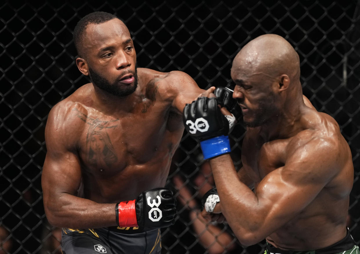 LONDON, ENGLAND - MARCH 18: (L-R) Leon Edwards of Jamaica punches Kamaru Usman of Nigeria in a lightweight fight during the UFC 286 event at The O2 Arena on March 18, 2023 in London, England. (Photo by Jeff Bottari/Zuffa LLC via Getty Images)