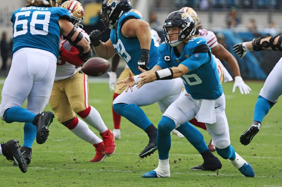 Jaguars quarterback Trevor Lawrence pitches the ball out to a running back during the team's 30-10 loss to the San Francisco 49ers on Nov. 21, 2021, at EverBank Stadium.