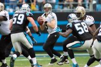 Dec 22, 2013; Charlotte, NC, USA; New Orleans Saints quarterback Drew Brees (9) drops back to pass during the second quarter against the Carolina Panthers at Bank of America Stadium. Mandatory Credit: Jeremy Brevard-USA TODAY Sports